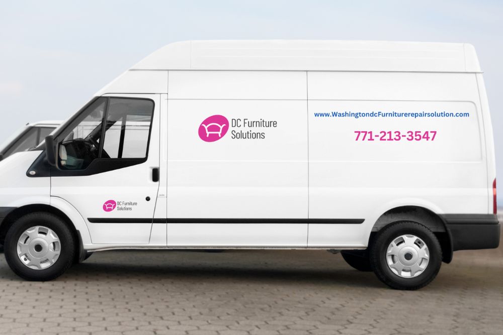 Two white vans, including one with "DC Furniture Solutions" logo, parked on a brick road, showcasing contact details on the side.