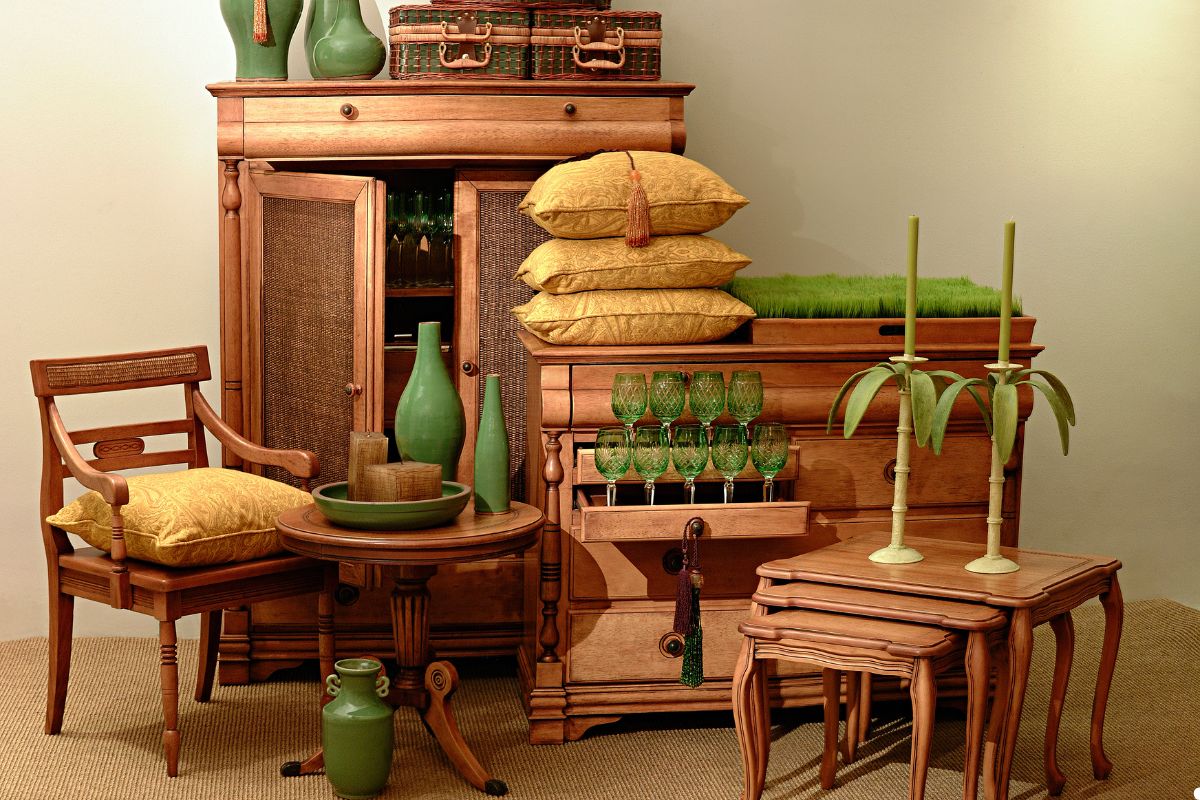 A cluttered room filled with various furniture pieces and numerous green plants, creating a vibrant and lively atmosphere. 